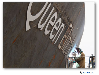 With less than a year to go until her maiden voyage, the legendary letters that will identify the newest addition to Cunard's regal fleet of Queens have been welded onto the bow of Queen Elizabeth at the Fincantieri yard in Trieste, Italy.